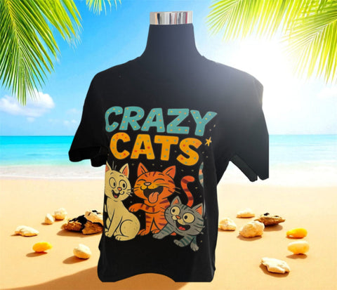 Black t-shirt with 'Crazy Cats' design on a mannequin against a beach background